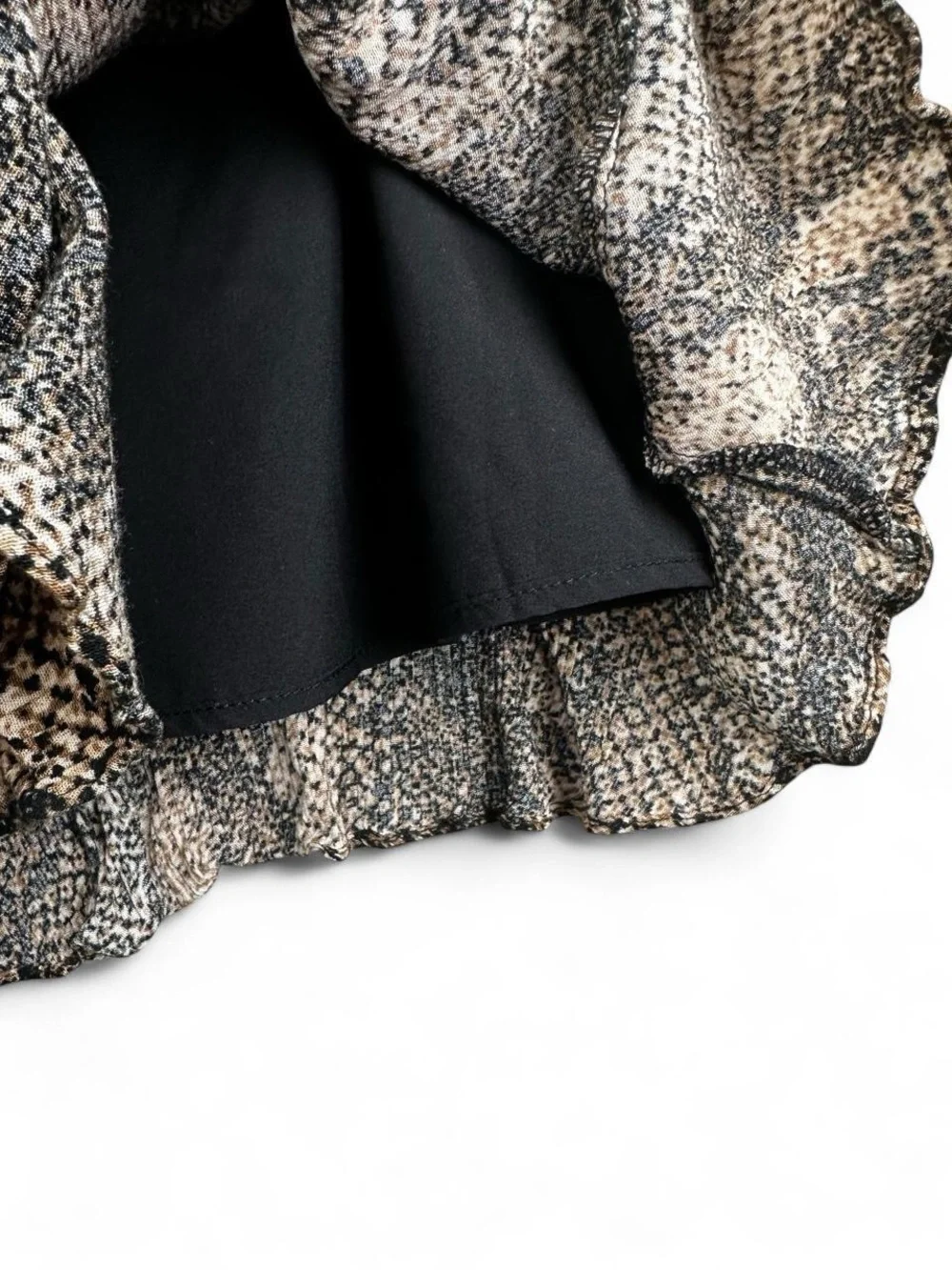 Scully black and beige snake print polyester mini skirt with ruffle hem